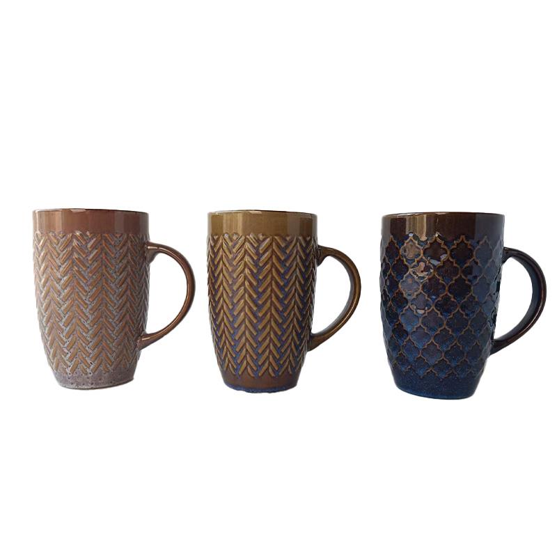 Three ceramic mugs with textured patterns on a white background