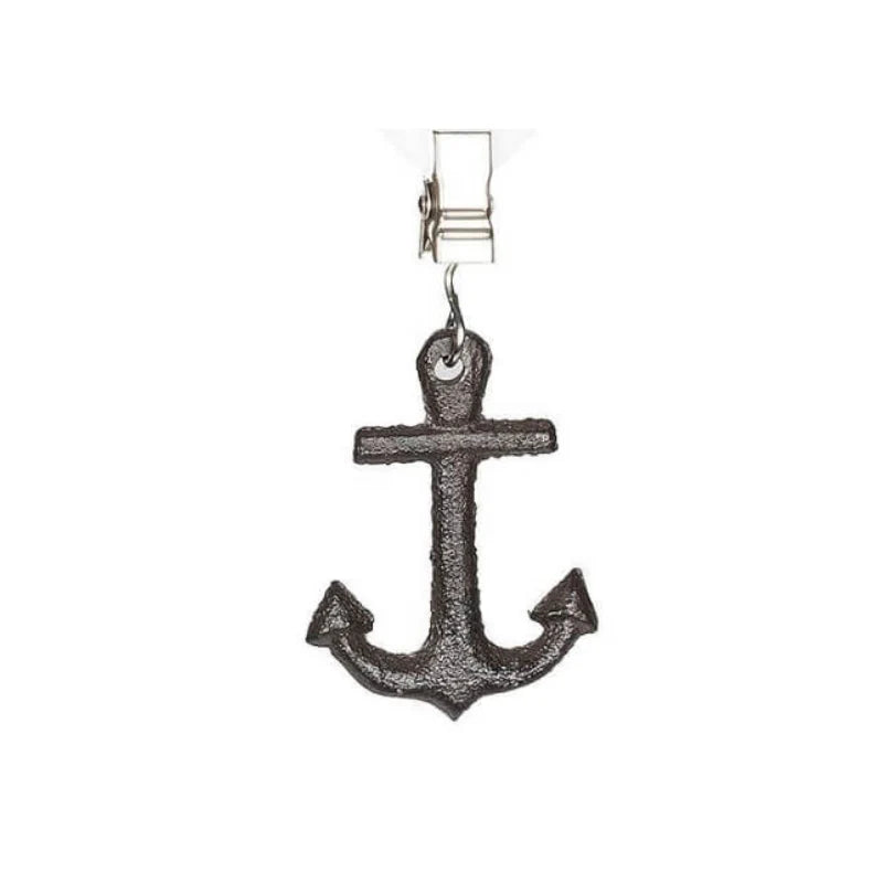 Anchor-shaped tablecloth weights on a white background
