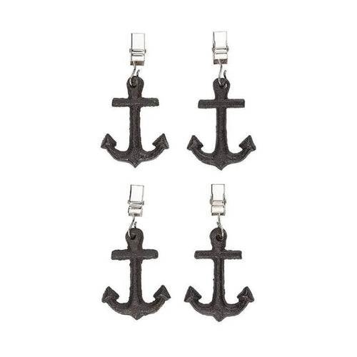 Four black anchor-shaped tablecloth weights on a white background