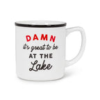 White mug with black interior, red and black text on a white background