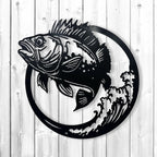 Black metal wall art featuring a detailed bass fish jumping in front of a circular wave design, mounted on a white wood plank background.