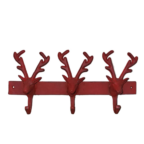 Red deer head-shaped coat rack on a white wall.