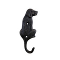 Black cast iron dog-shaped wall hook on a white background