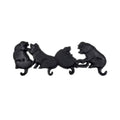 Black cast iron pig hook on a white background