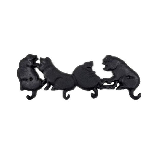 Black cast iron pig hook on a white background