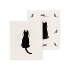 Two white Swedish dishcloths with black cat and mouse designs on a white background
