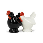 Black and white rooster-shaped salt and pepper shakers on a white background