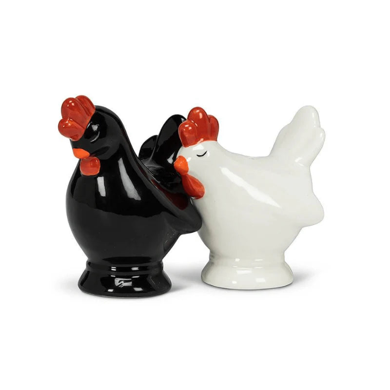 Black and white rooster-shaped salt and pepper shakers on a white background
