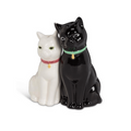 Black and white cat-shaped salt and pepper shakers on a white background