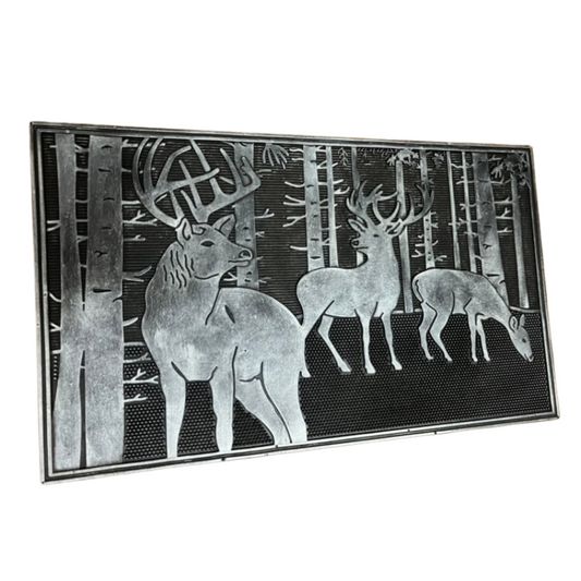 Decorative doormat with deer design in a forest setting