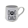 White mug with 'DOG DAD' text and paw print on a white background