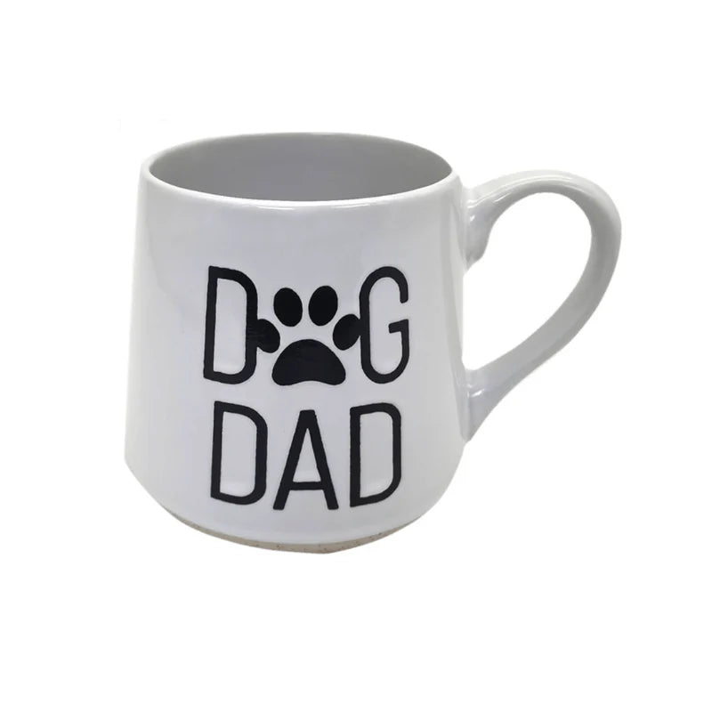 White mug with 'DOG DAD' text and paw print on a white background