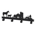 Black metal wall art with farm scene including a barn, tractor, and animals on a white background