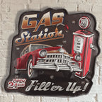 Decorative sign of a vintage gas station with a car and pump on a brick wall background.