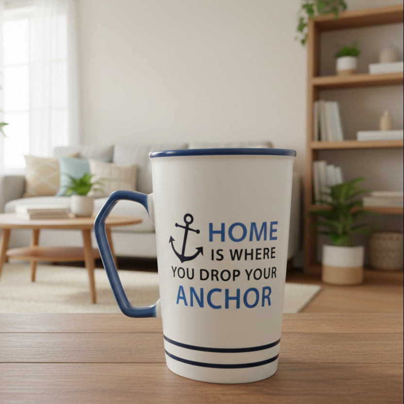 White mug with blue handle and text on a wooden surface