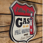 Vintage-style 'Filling Station Gas & Oil Full Service' sign on a wooden background