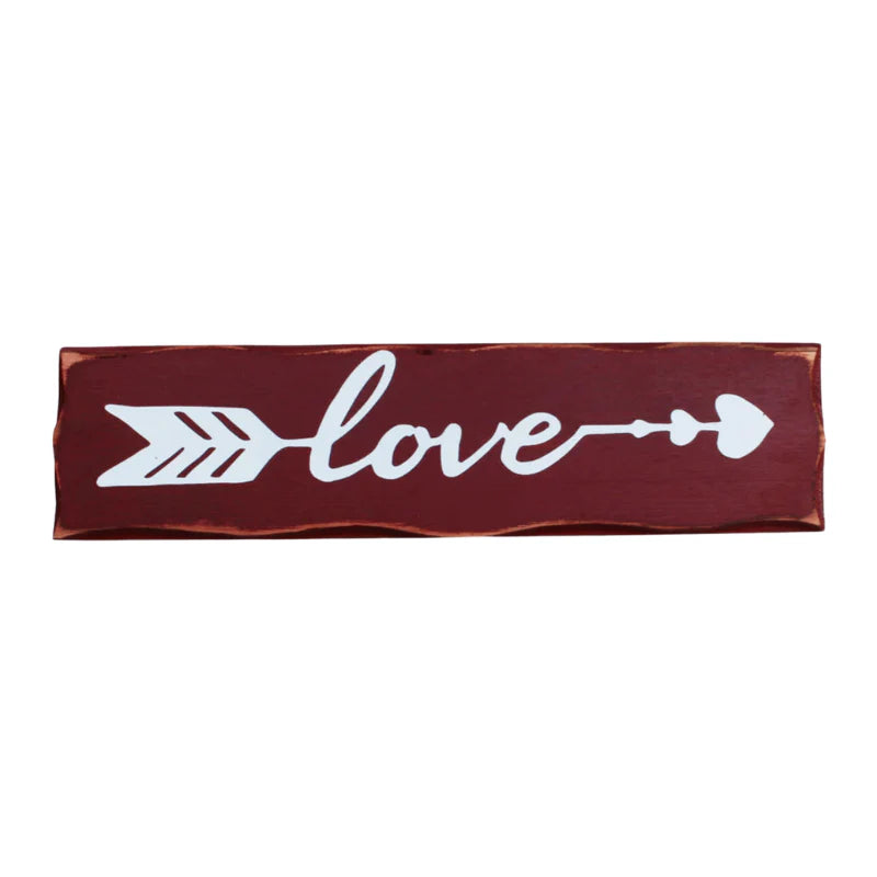 Decorative red and white sign with 'love' text and arrow design on a white background