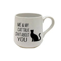 White mug with black text and a cat illustration on a white background