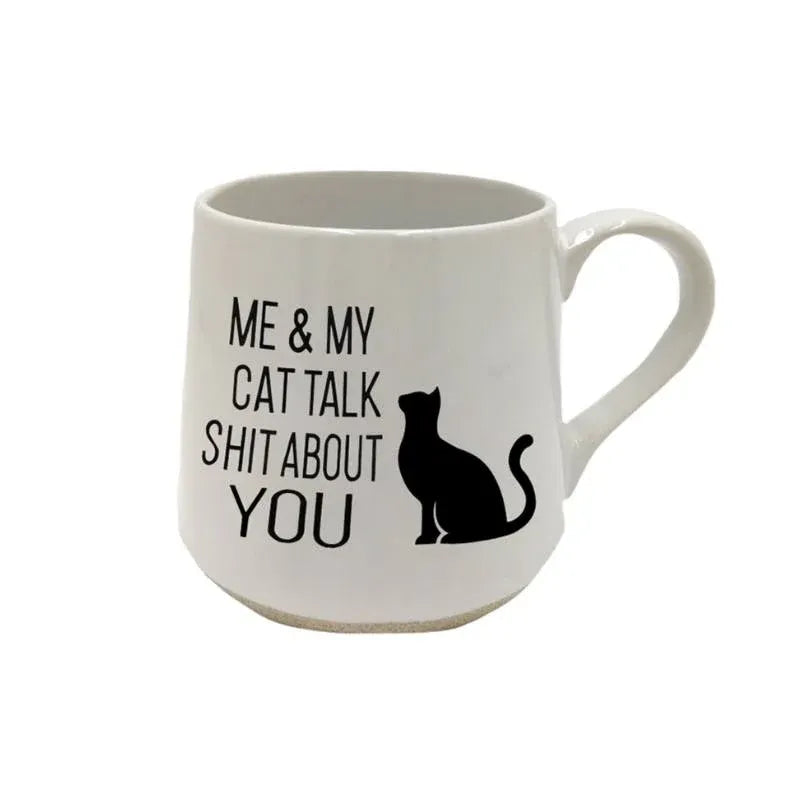 White mug with black text and a cat illustration on a white background