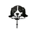 Decorative wall hook shaped like a dog with black design on a white background