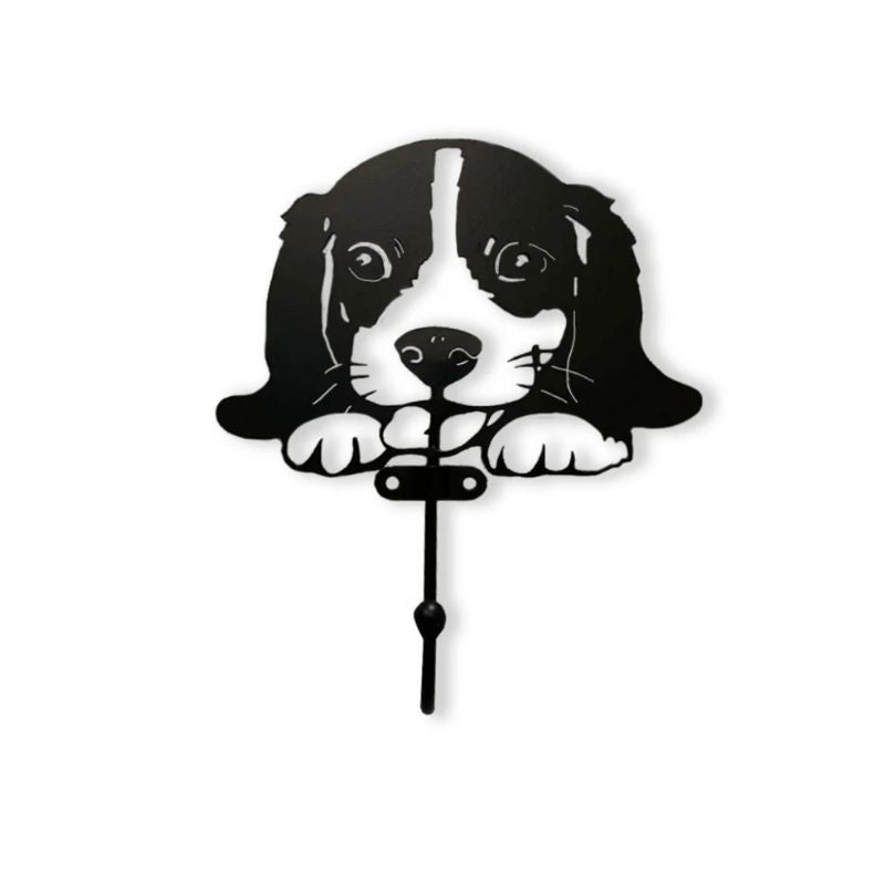 Decorative wall hook shaped like a dog with black design on a white background