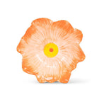 Floral-shaped object with orange petals and a yellow center on a white background