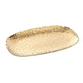 Gold oval platter on a light gray background